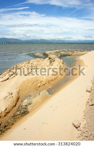 Reclamation project at Quy Nhon, Binh Dinh, Viet Nam, fill up sand on water to make construction plan, try to change nature for human profit, fill soil at seaside