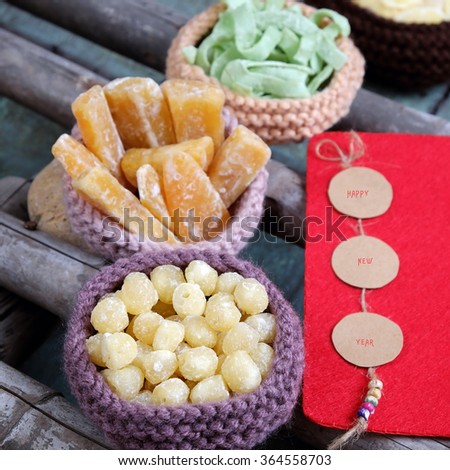 Vietnamese food for Tet holiday in spring, jam is traditional food on lunar new year, can make from sweet potato, lotus seed, ginger with sugar, colorful background for Vietnam custom