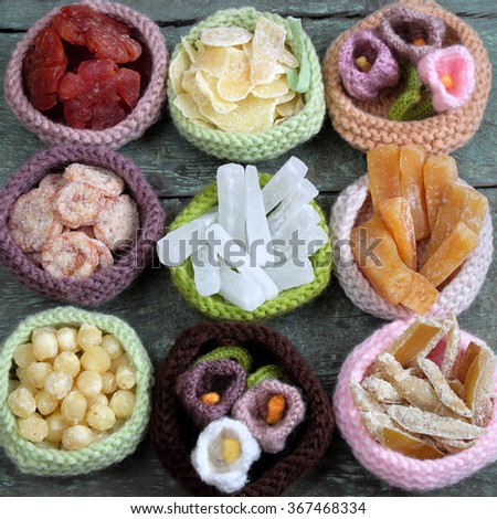 Amazing of Vietnamese food for Tet holiday in spring, jam is traditional food on lunar new year, make from sweet potato, lotus seed, ginger, mango with sugar, colorful background for Vietnam culture
