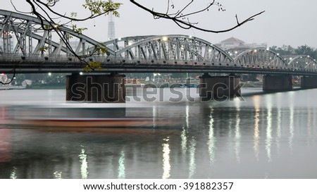 HUE, VIET NAM- FEB 19, 2016: Truong Tien Bridge, cross Huong river, an old bridge link with history, Trang Tien brigde reflect on water, old architect, make from steel, landscape at evening, Vietnam