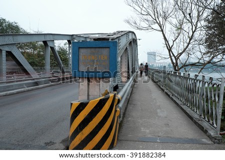 HUE, VIET NAM- FEB 19, 2016: Truong Tien Bridge, cross Huong river, an old bridge link with history, Trang Tien brigde reflect on water, old architect, make from steel, landscape at evening, Vietnam