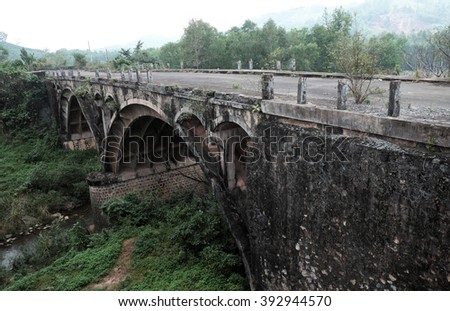QUANG TRI, VIET NAM- FEB 23, 2016: Dau Mau bridge on Ho Chi Minh trail, an old bridge link with Vietnam war history make by French locate at Cam Lo, with amazing architect, pass green jungle