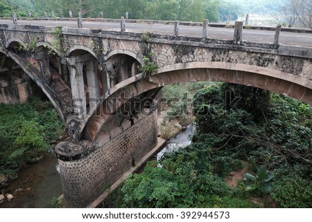 QUANG TRI, VIET NAM- FEB 23, 2016: Dau Mau bridge on Ho Chi Minh trail, an old bridge link with Vietnam war history make by French locate at Cam Lo, with amazing architect, pass green jungle