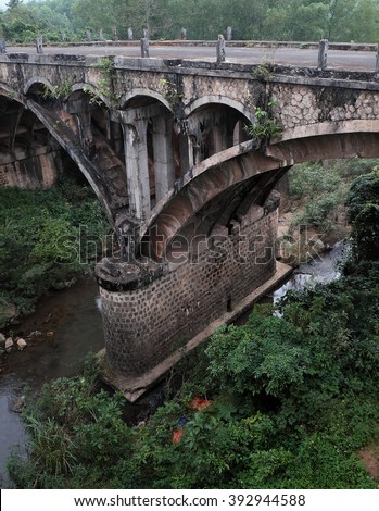 QUANG TRI, VIET NAM- FEB 23, 2016: Dau Mau bridge on Ho Chi Minh trail, an old bridge link with Vietnam war history make by French locate at Cam Lo, with amazing architect, pass green jungle