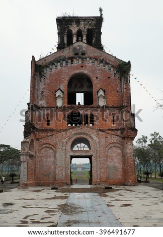 QUANG TRI, VIET NAM- FEB 20, 2016: Old church at La Vang holy land with ancient red brick wall, a place for Christian faithful to go pilgrimage, amazing old architect at Quangtri, Vietnam