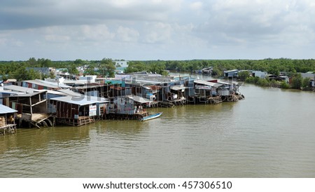 CA MAU, VIET NAM- JULY 16, 2016: Waterway at Mekong Delta, life on Nam Can river, poor residential with house make from metal sheet among mangrove forest, Camau, Vietnam