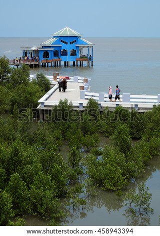 CA MAU, VIET NAM- JULY 16, 2016: Group of tourist travelling Dat Mui, a geography place people walking on breakwater along the beach