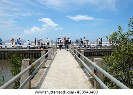 CA MAU, VIET NAM- JULY 16, 2016: Group of tourist travelling Dat Mui, a geography place people walking on breakwater along the beach