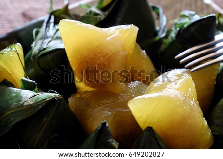Vietnamese traditional food for may 5th, is double five festival or tet doan ngo, sticky rice cake in green leaf, also call banh u tro with pyramidal shape