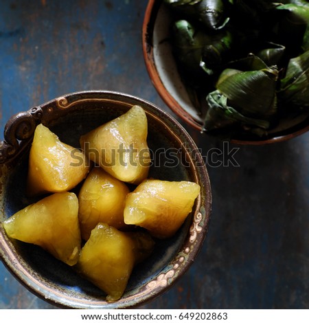 Vietnamese traditional food for may 5th, is double five festival or tet doan ngo, sticky rice cake in green leaf, also call banh u tro with pyramidal shape