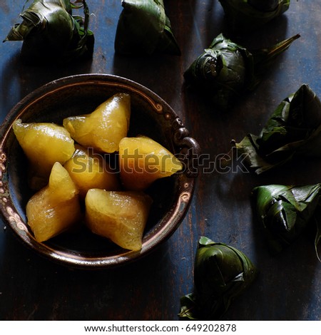 Vietnamese traditional food for may 5th, is double five festival or tet doan ngo, sticky rice cake in green leaf, also call banh u tro with pyramidal shape