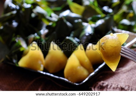 Vietnamese traditional food for may 5th, is double five festival or tet doan ngo, sticky rice cake in green leaf, also call banh u tro with pyramidal shape