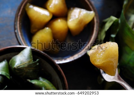 Vietnamese traditional food for may 5th, is double five festival or tet doan ngo, sticky rice cake in green leaf, also call banh u tro with pyramidal shape
