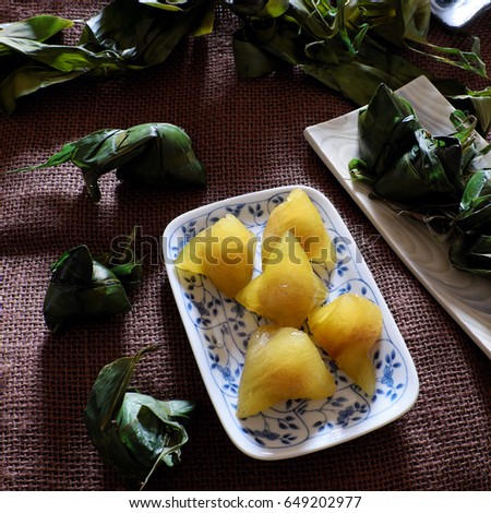 Vietnamese traditional food for may 5th, is double five festival or tet doan ngo, sticky rice cake in green leaf, also call banh u tro with pyramidal shape