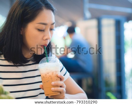 Asian Woman Drink Iced Coffee In The Cafe Asian Woman Drink Iced Coffee In The Cafe