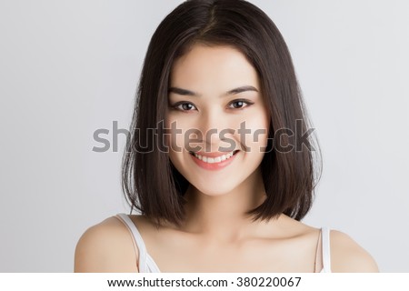Close up of young Asian beautiful woman with smiley face.