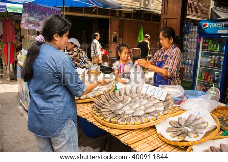 Suphan Buri, Thailand - Apr 3, 2016 -women sell dried fish at Samchuk market