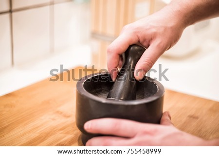 Man Is Cooking Using Hands With Mortar And Pestle Grinding Species Medical Herbs Man Is Cooking Using Hands With Mortar And Pestle Grinding Species Medical Herbs