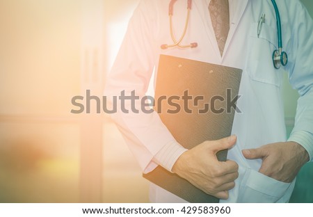 close up of patient and doctor taking notes. sunset