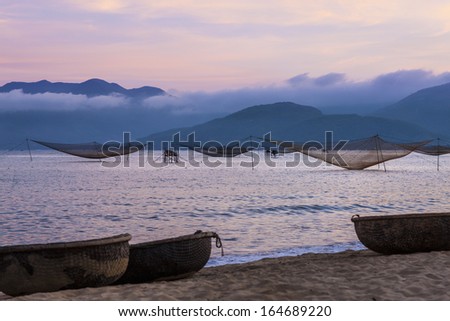 CIRCA APRIL 2010 - QUY NHON, VIETNAM - Fishing nets standing at rest off the shore, on 25 April 2010, at Quy Nhon, Vietnam.