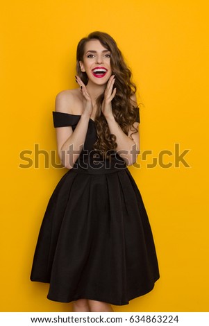 https://thumb1.shutterstock.com/display_pic_with_logo/1816907/634863224/stock-photo-beautiful-young-woman-in-black-cocktail-dress-is-shouting-and-looking-at-camera-three-quarter-634863224.jpg