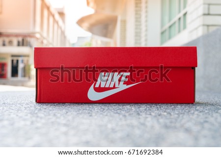 BANGKOK, THAILAND - JULY 2, 2017: Nike box shoes on cement floor, Nike, Inc. is an American multinational corporation that designs, develops, manufactures and sells footwear and other items