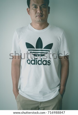 BANGKOK, THAILAND - JULY 9, 2017: Adidas logo on man T-shirt. Adidas is German designer and manufacturer of sports clothing and accessories; largest in Europe and 2nd biggest in the world.