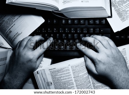 Hands on keyboard symbolizing overloaded writer or any job or studies involving lot of typing and working with a computer.