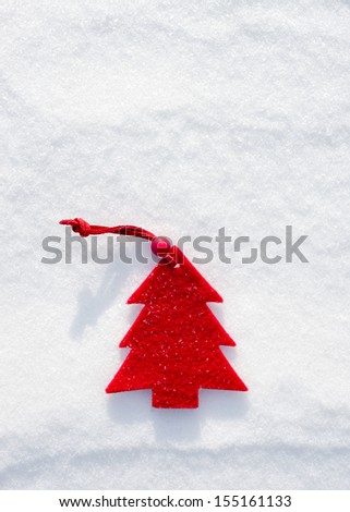christmas red tree toys at snow background
