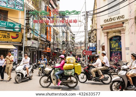 Hanoi, Vietnam - May 18, 2016: Busy motorbike traffic in the Old Quarter in Hanoi. In recent decades, motorbikes have overtaken bicycles as the main form of transportation causing frequent gridlocks.