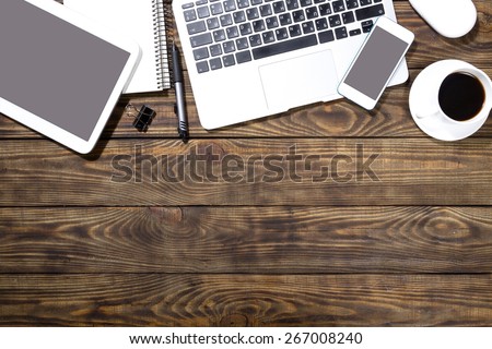 Writer, laptop, table.