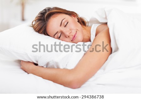 stock-photo-sleeping-women-bed-294386738