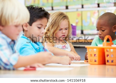 Group Of Elementary Age Children In Art Class