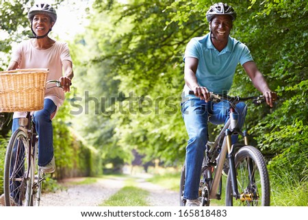 Mature African American Couple On Cycle Ride In Countryside