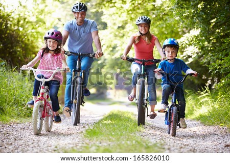 Family On Cycle Ride In Countryside