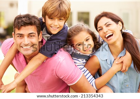 stock-photo-portrait-of-happy-family-in-garden-at-home-213354343.jpg