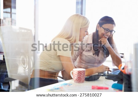 Women working together, office interior