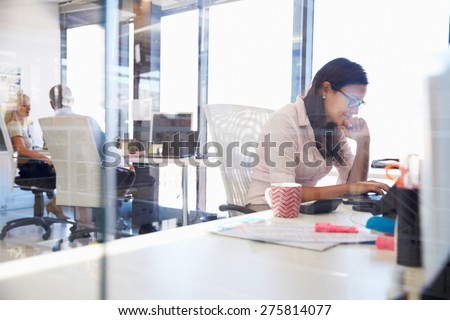 Woman working at computer in an office