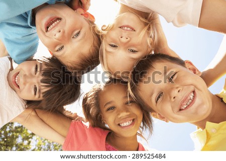 Group Of Children Looking Down Into Camera
