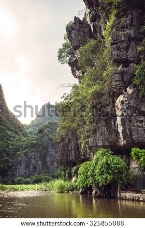Landscape Vietnam. River view in the dim light of dusk at Ninhbinh, Tam Coc, Vietnam
