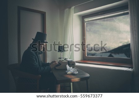 Vintage Indoor Writer is Writing a Novel on Typewriter