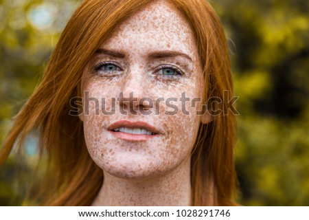 stock photo beautiful red haired irish girl with blu eyes red hair and lots of freckles 1028291746