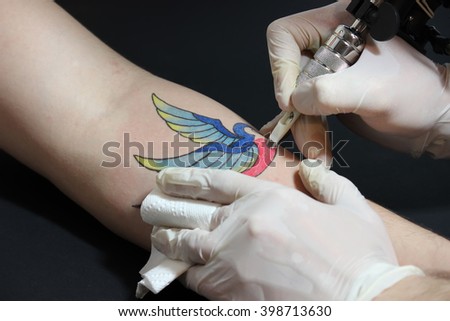 tattooer showing process making tattoo on stock photo 398713630 tattooer showing process making tattoo on stock photo 398713630
