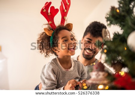 People Decorating A Christmas Tree african family decorating christmas tree stock images, royalty People Decorating A Christmas Tree african family decorating christmas tree stock images, royalty