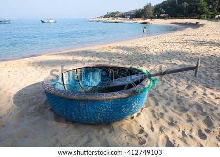 Round fishing boat made from bamboo and wood on the beach sand of Quy Nhon, central Vietnam.