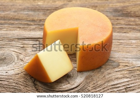 Cheese wheel on wooden table