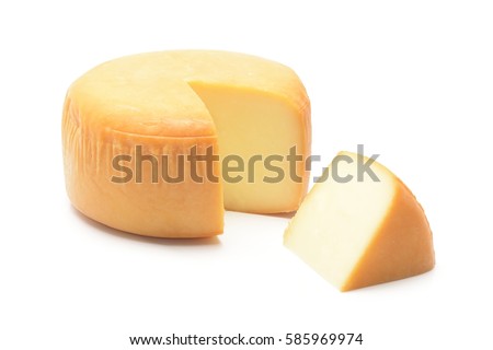 Cheese wheel with a piece of cheese on a white background