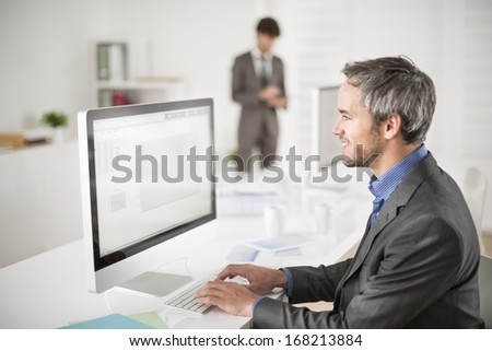 businessman works on computer at his office