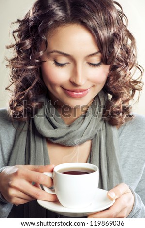 https://thumb1.shutterstock.com/display_pic_with_logo/195826/119869036/stock-photo-beautiful-woman-drinking-coffee-or-tea-beauty-girl-with-cup-of-hot-steaming-beverage-119869036.jpg