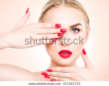 https://thumb1.shutterstock.com/display_pic_with_logo/195826/311361713/stock-photo-beautiful-woman-with-blond-hair-fashion-model-with-red-lipstick-and-red-nails-portrait-of-glamour-311361713.jpg
